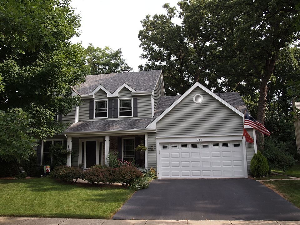 Front view wooded corner lot on cul-de-sac