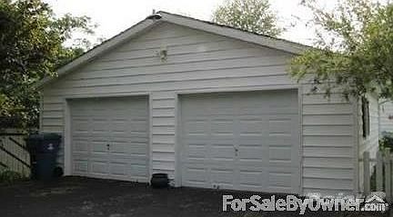 Two car garage
						:
						garage has large blacktop and driveway, attached to house by large sunroom.
