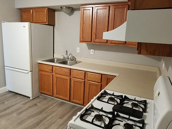 Kitchen with stove and oversize refrigerator included
