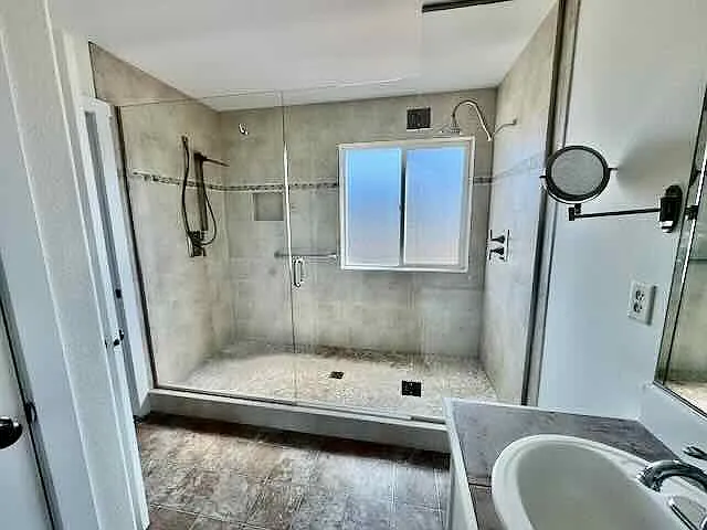 Primary bathroom with oversized shower and two shower heads
