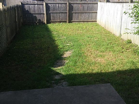 Private back yard with patio.