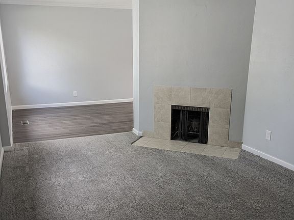 Living room off the front door with a tile entry way.