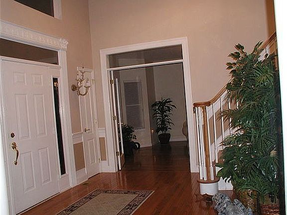 Inviting foyer leads to Great Room & Juliet stairway