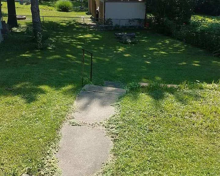 Big backyard with a fire pit.