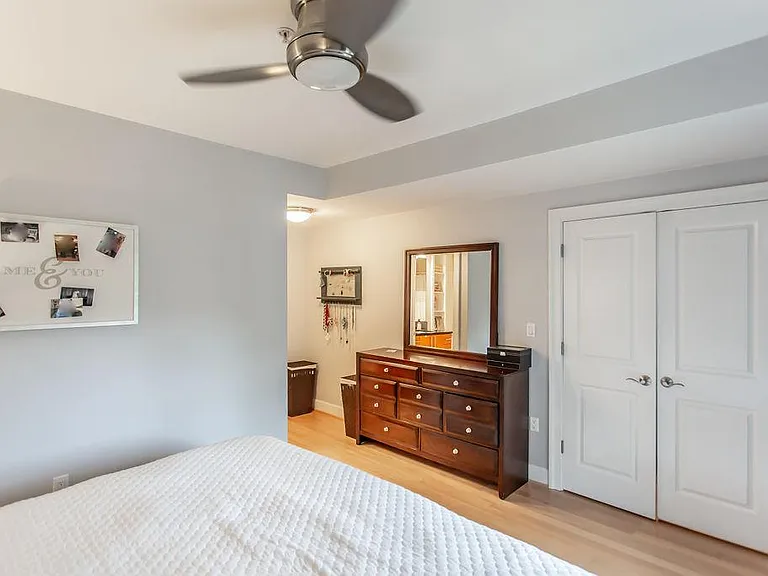 Primary bedroom with view of walk-in closet