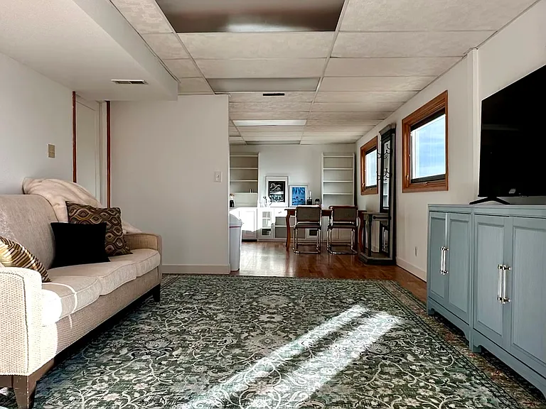 Living room opens to kitchen, dining room and laundry room.