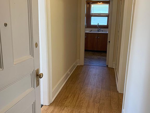 Hall from entrance to kitchen. LR to left, Bedroom to right.
