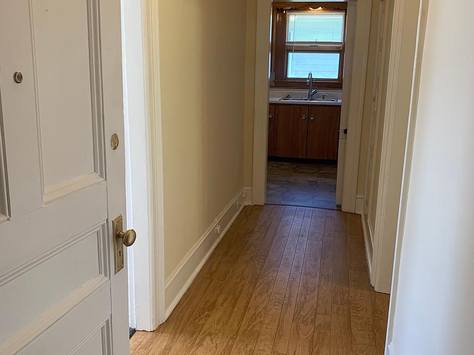 Hall from entrance to kitchen. LR to left, Bedroom to right.