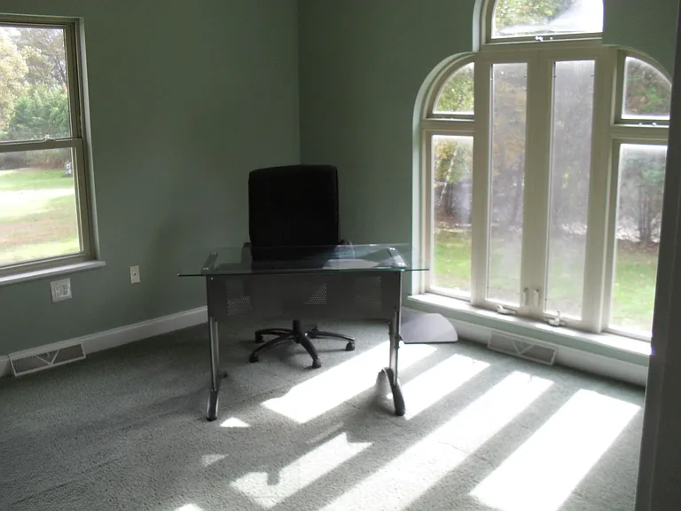 Office has a door and can be used as a 5th bedroom. Powder room is next to it.