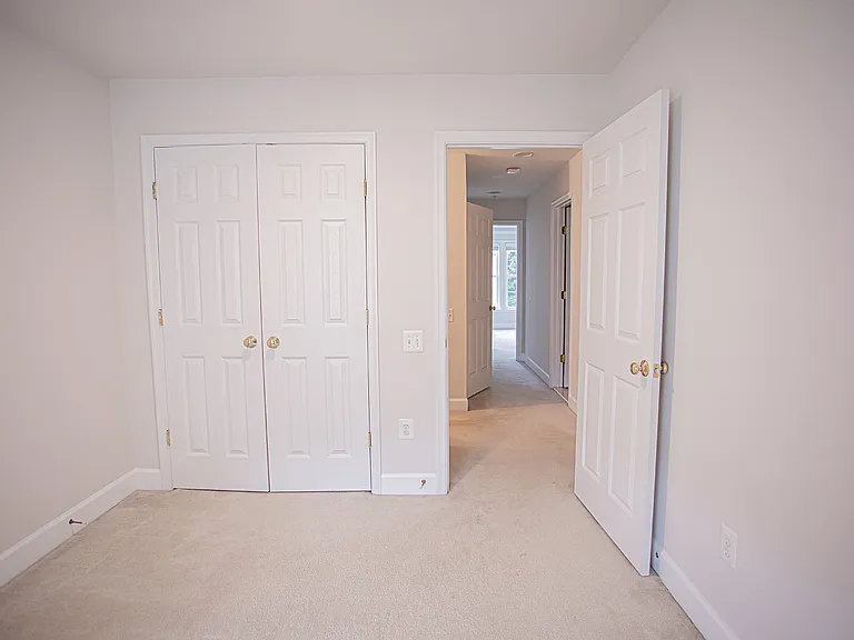 Bedroom 1 featuring good size built-in closet with double doors
