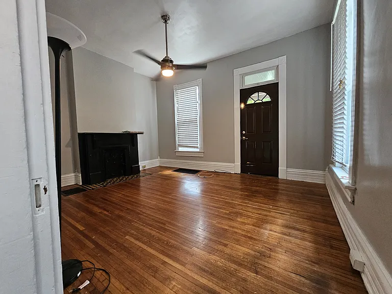 View from the middle of kitchen/living room right by the stairs to the second floor.