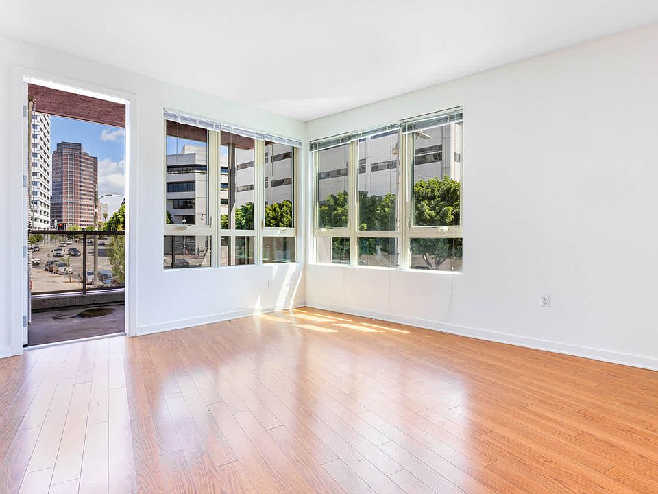 Living Room with Balcony and Hard Surface Flooring