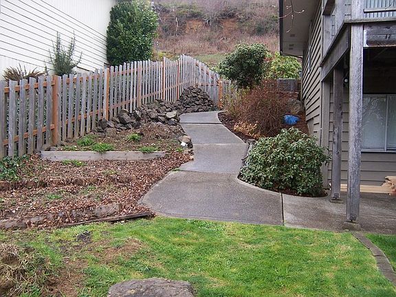 East side yard to upper level and parking