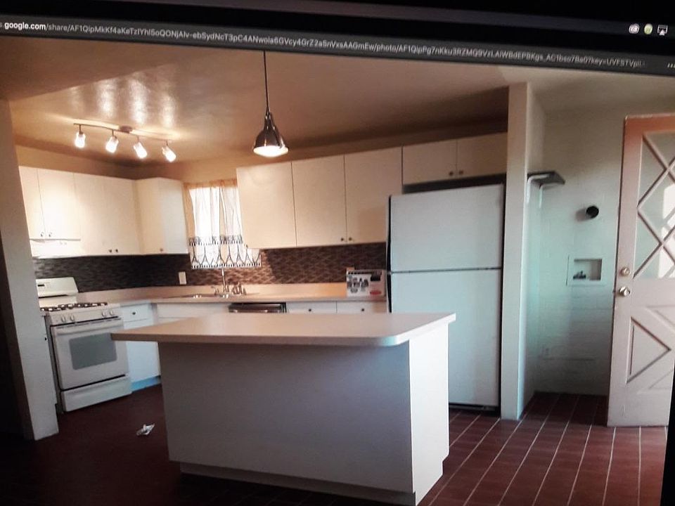 Kitchen with washer/dryer hookups by door