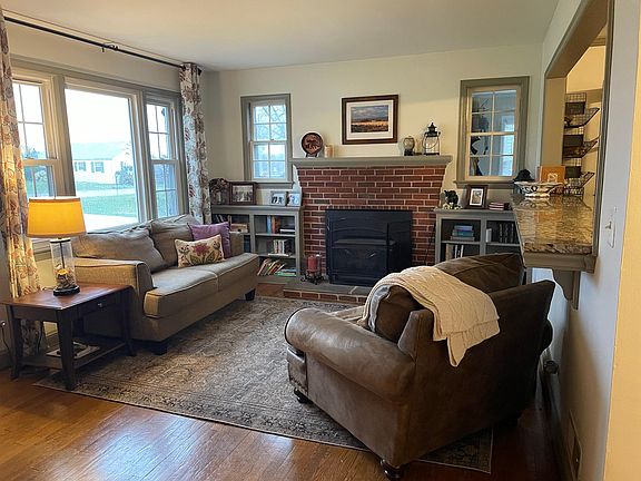 Front room with working wood fireplace.