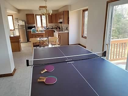 Game room, kitchen, another breakfast nook to the left, or eat on the porch viewing the lake.