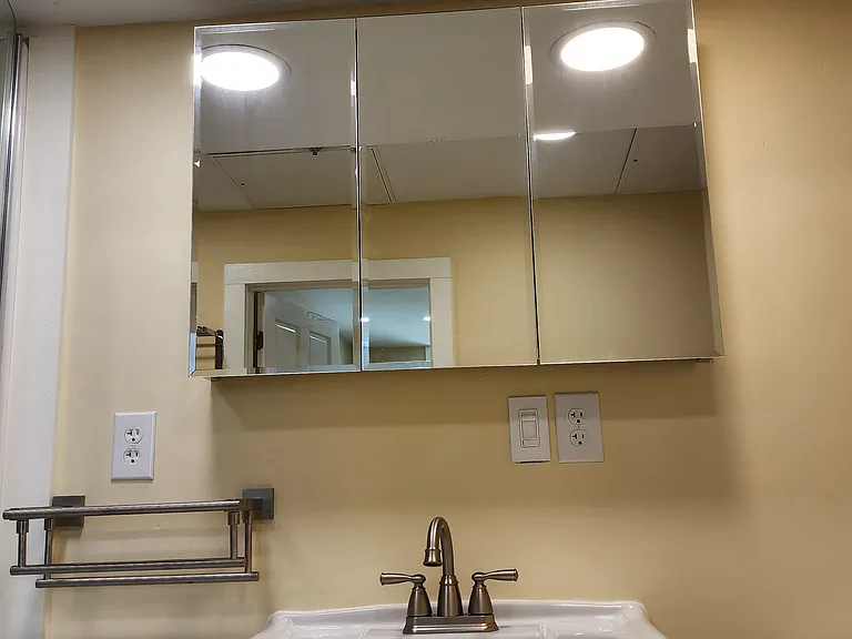 The doors closed on the Full mirrored med cabinet