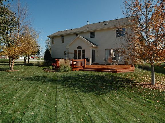in ground sprinkler system and partially fenced in back yard