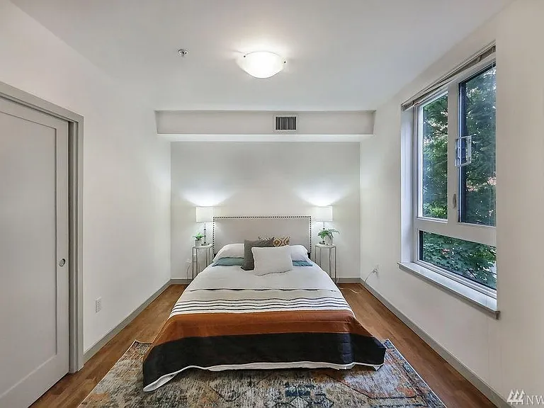 Second bedroom with window and closet
