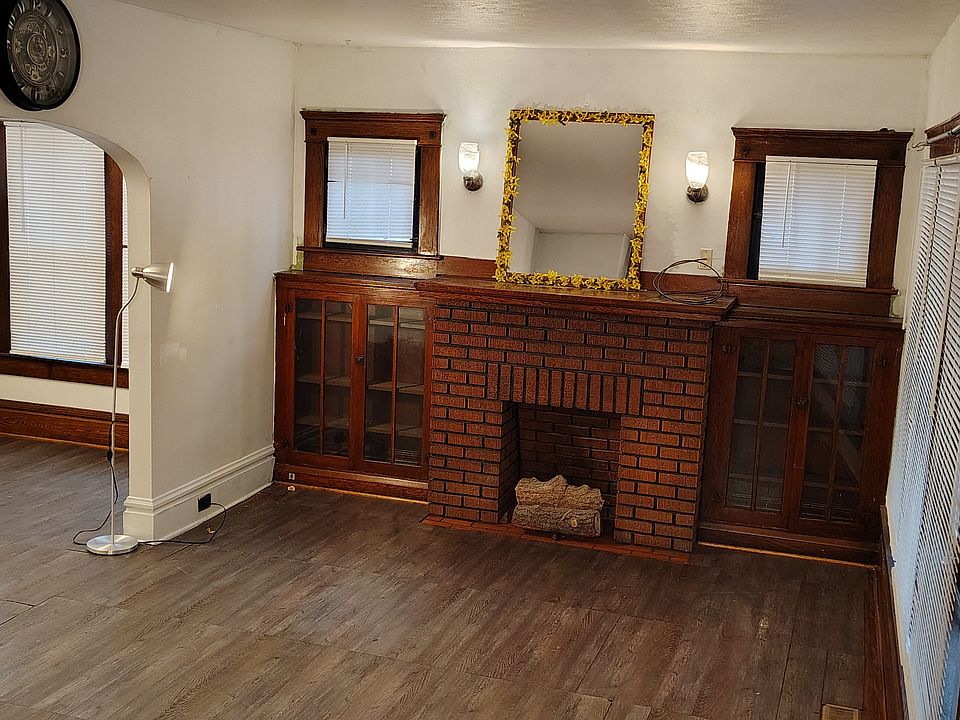 Living Room with built-in cabinets. Fireplace is not functional.