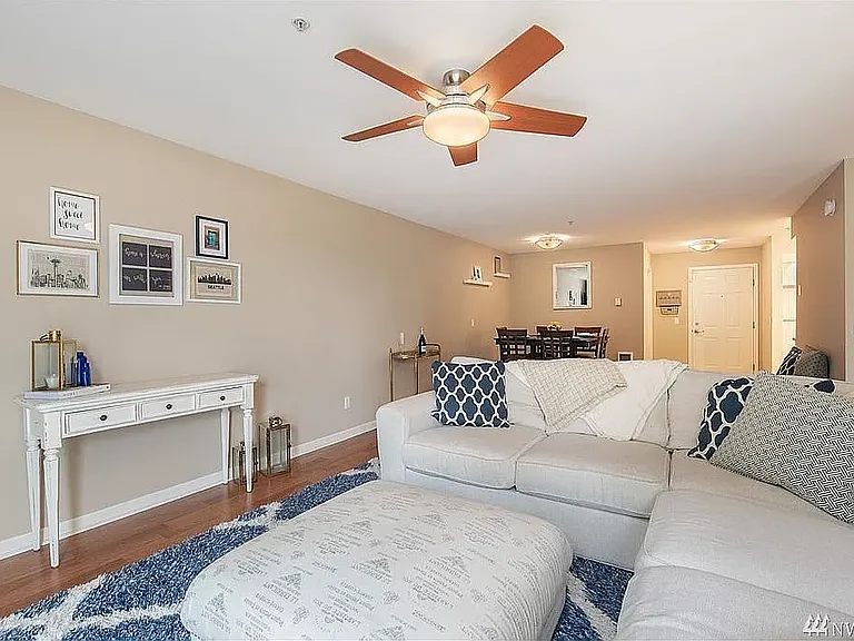 (Staged) Living room; looking in from the patio door towards entry & kitchen.