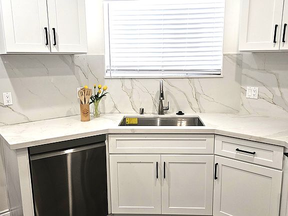 Kitchen Sink and Calacatta Marble Countertops