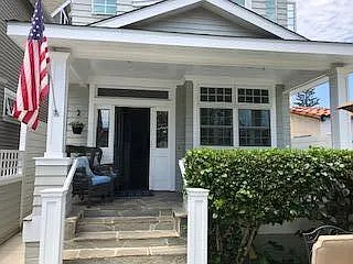 View from street of front entry and private yard