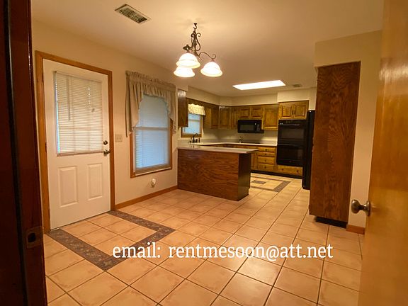 Entry from garage - view of the dining area and kitchen.