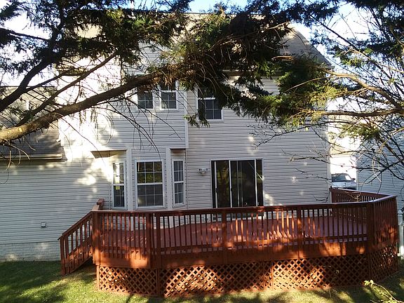 Back of home with deck