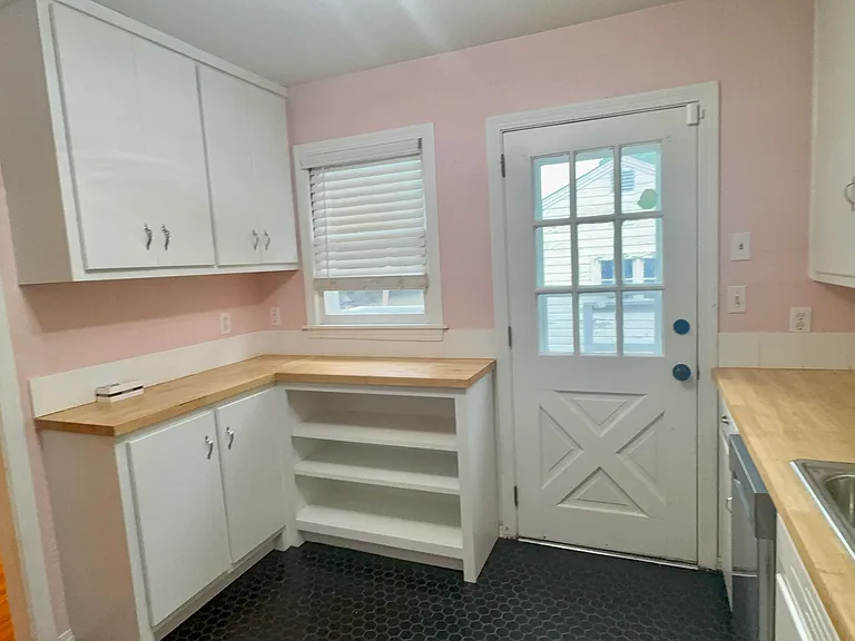 Lots of nice storage in kitchen. Door opens to backyard.