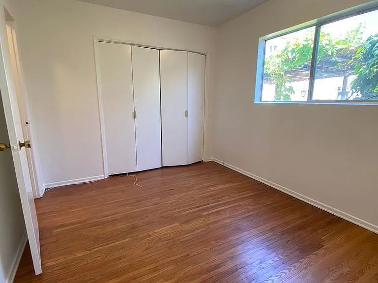 Second bedroom - bright with new hardwood floors.