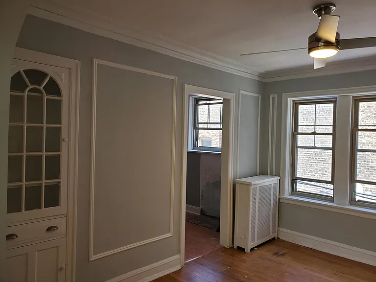 dining room with built-in china cabinet. Kitchen throughthe door way