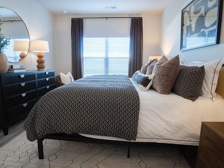 Primary Bedroom with king size bed and large window letting in nice natural light.