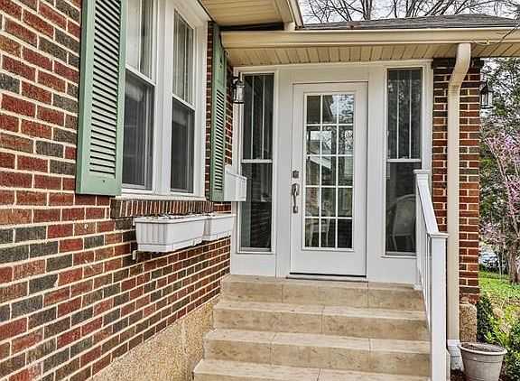 Enter the home through a charming three-season foyer/sun room