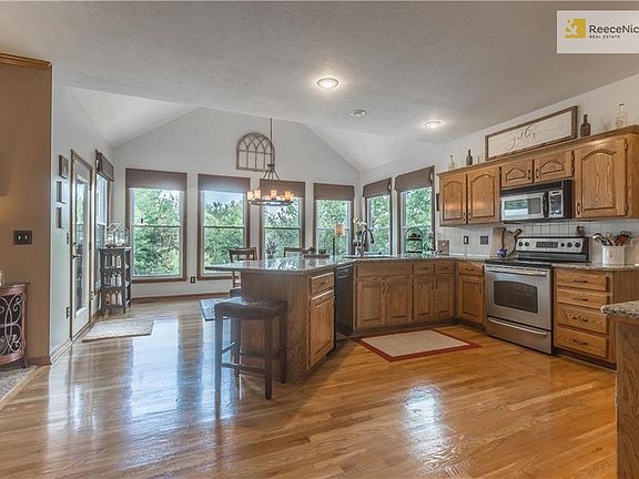 Huge kitchen with gleaming hardwood floors