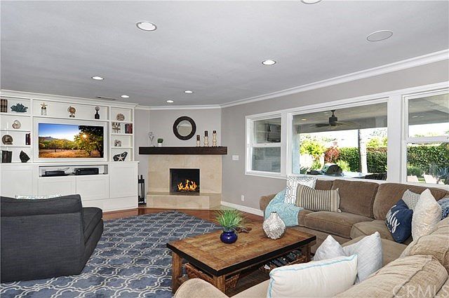 Welcome to 1230 E. Rose in Orange!  Family Room with built-in wall unit entertainment center and a cozy fireplace. Lots of natur