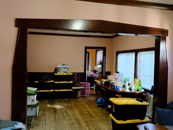 View from living area into dining room on 1st floor. Please forgive the items, current tenant has rented since 2012 and vacant photos aren't available.