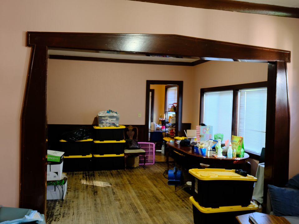 View from living area into dining room on 1st floor. Please forgive the items, current tenant has rented since 2012 and vacant photos aren't available.