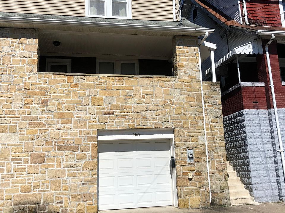 Front of house with one car garage and parking