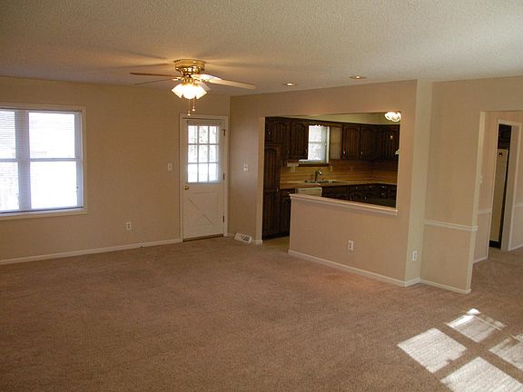 Great room showing kitchen and back door.