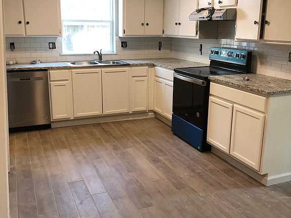 NEW GRANITE & BACKSPLASH + APPLIANCES & DISPOSAL.

NEW TILE FLOORS