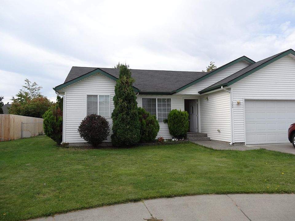 FRONT WITH AUTO SPRINKLERS AND FENCED REAR YARD
