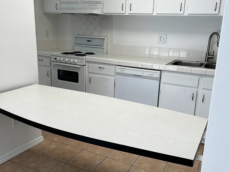 Kitchen, with shelf for groceries, homework, dining, etc.