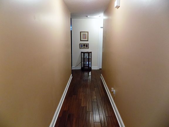Hallway with wood flooring
