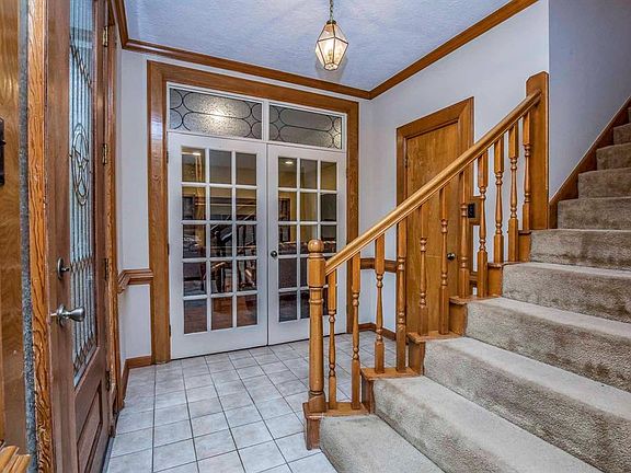 French doors lead to a large den that has so many options... playroom, media room, gameroom, extra large home office.