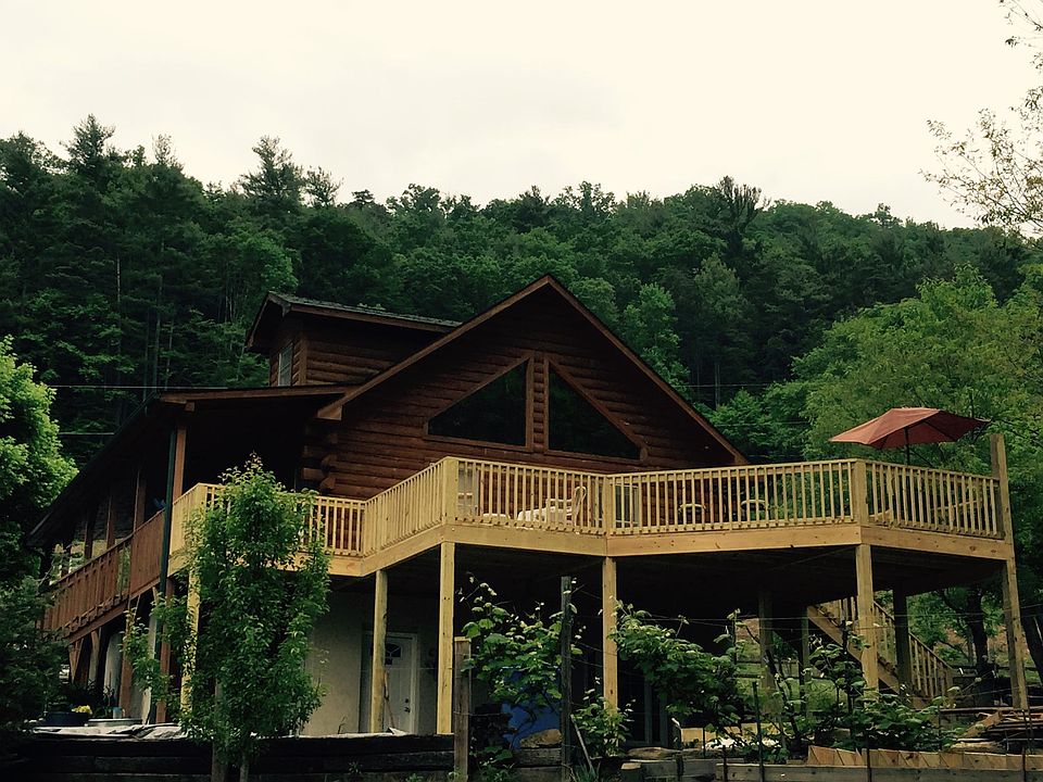 Giant deck for dining outside and looking at 1 1/2 acre Serenity Garden with waterfall.