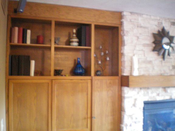 Custom cabinetry. There is a computer desk and oak filing cabinet 