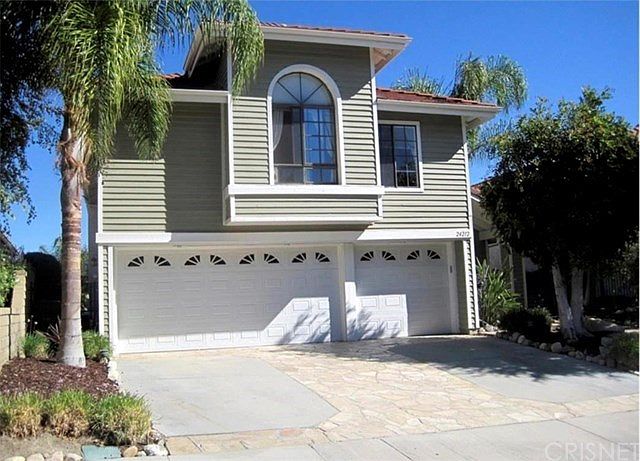FRONT VIEW WITH 3 CAR GARAGE