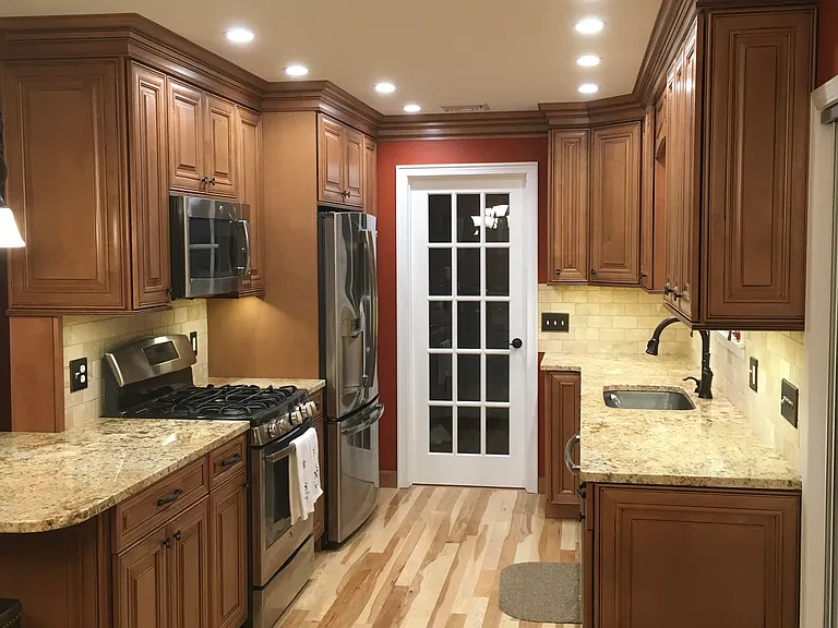 Bright Kitchen with SS Appliances and Under Cabinet Lighting