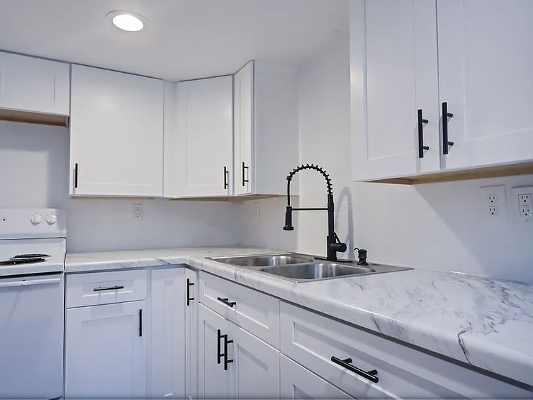 Kitchen is fully equipped with soft close doors, laminate counters and appliances included